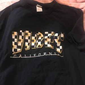 Shirt that says “VIBES”